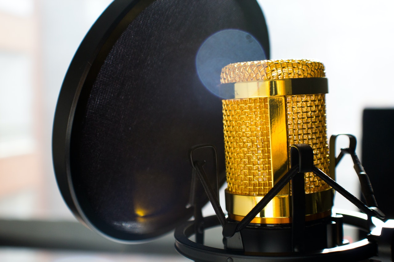 close-up-photo-of-gold-colored-and-black-condenser-682082